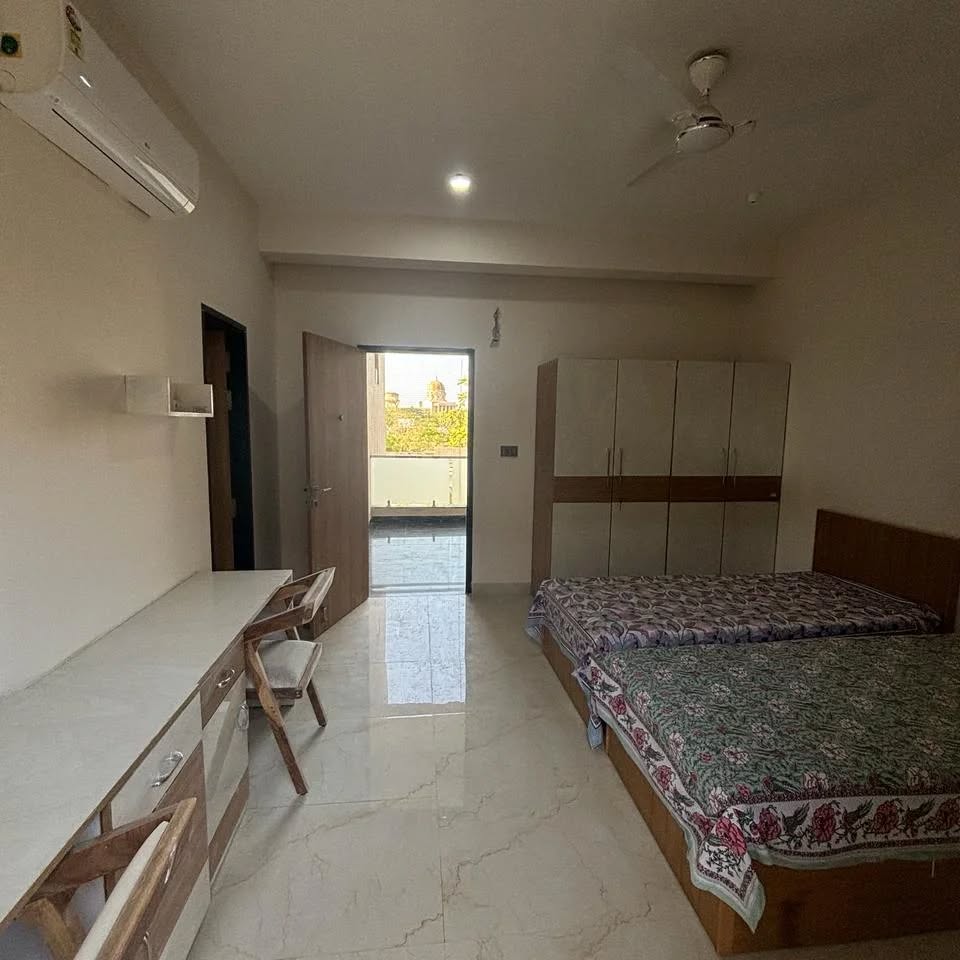 A spacious, air-conditioned Nirvana room with study desk and balcony