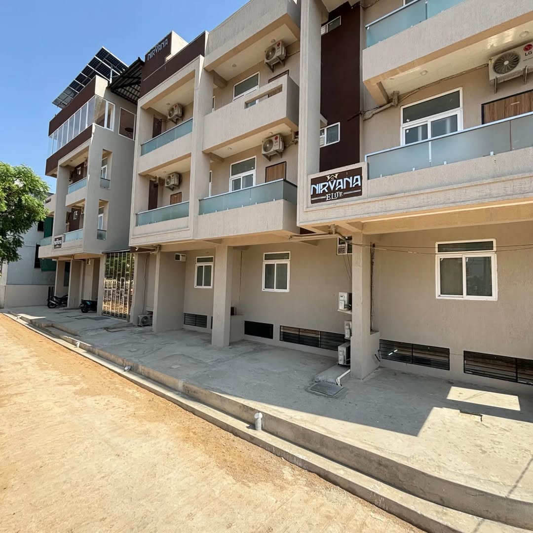 Nirvana Elite — the residence exterior with balconies and parking